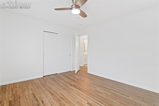 unfurnished bedroom featuring a closet, ceiling fan, and light hardwood / wood-style flooring