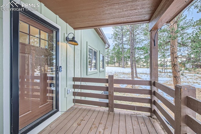 view of snow covered deck