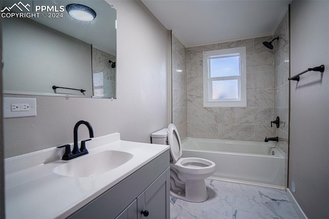 full bathroom featuring vanity, toilet, and tiled shower / bath