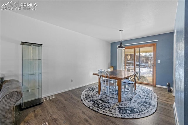 dining space with dark wood-type flooring