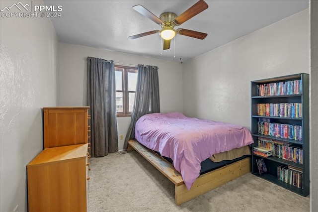 bedroom with ceiling fan and light carpet