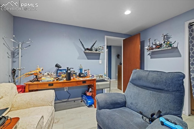 office area with light hardwood / wood-style flooring