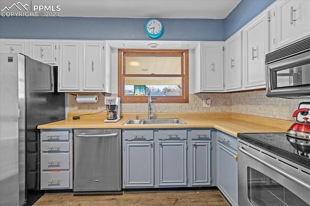 kitchen featuring white cabinetry and stainless steel appliances