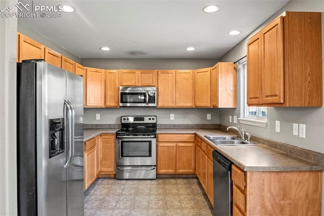 kitchen featuring appliances with stainless steel finishes and sink