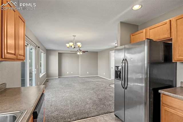 kitchen featuring light carpet, a textured ceiling, ceiling fan with notable chandelier, stainless steel appliances, and pendant lighting