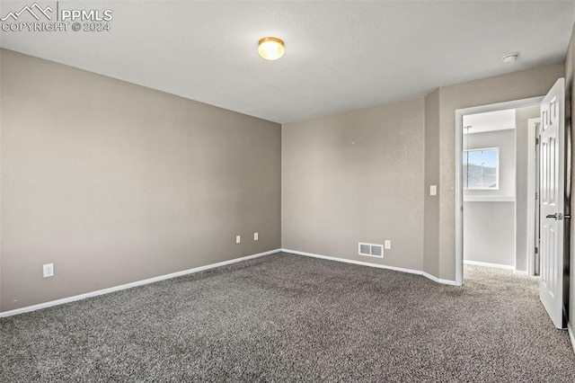 spare room featuring carpet flooring