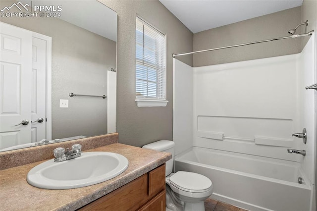 full bathroom with washtub / shower combination, vanity, and toilet