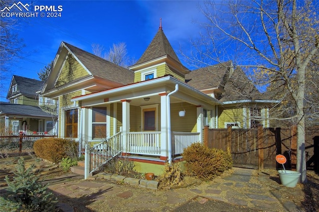 victorian-style house featuring a porch