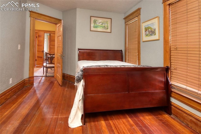 bedroom with hardwood / wood-style floors