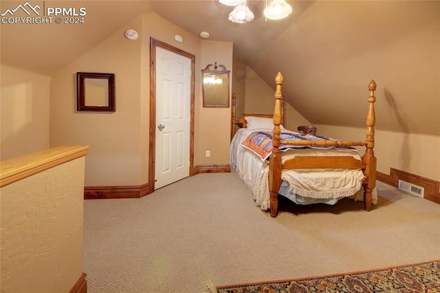 bedroom with ceiling fan, light colored carpet, and vaulted ceiling