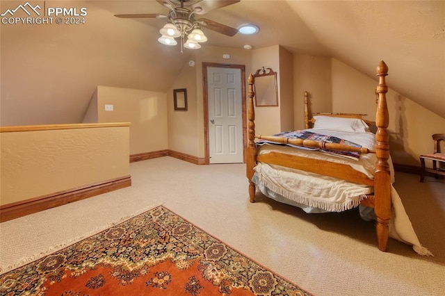 carpeted bedroom with vaulted ceiling and ceiling fan