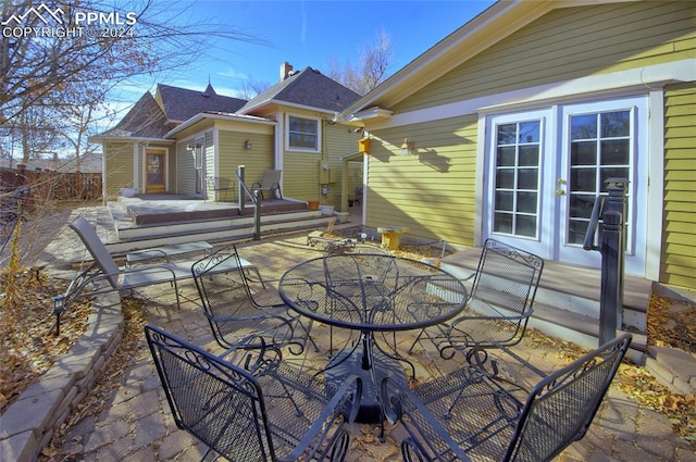 rear view of house with french doors and a patio