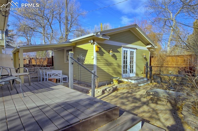 wooden deck featuring french doors