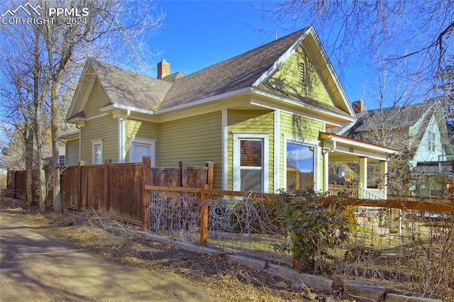 view of side of property with a porch