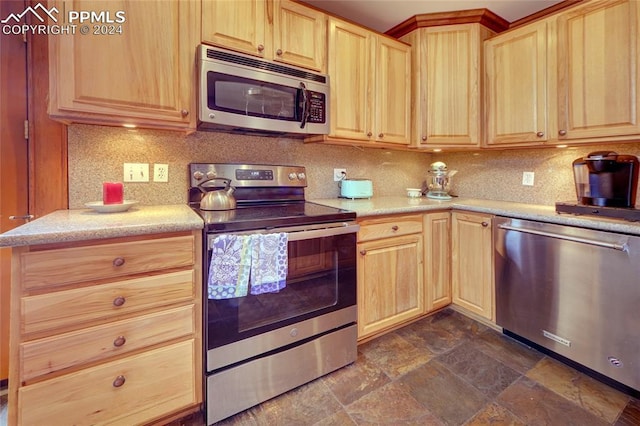 kitchen featuring decorative backsplash, light brown cabinetry, and appliances with stainless steel finishes