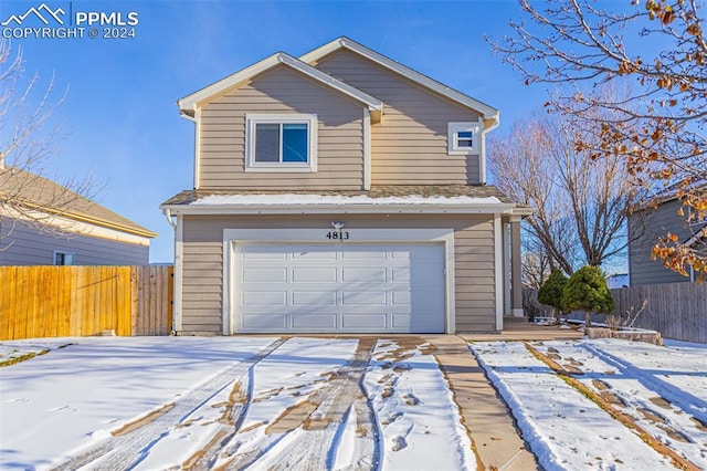 view of snow covered garage