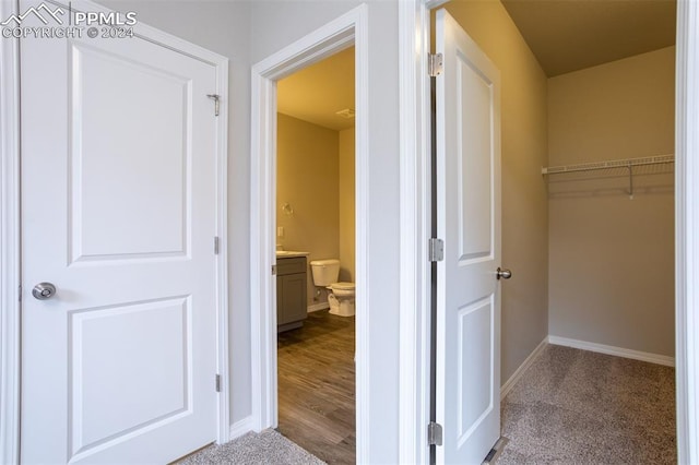 hallway featuring hardwood / wood-style flooring