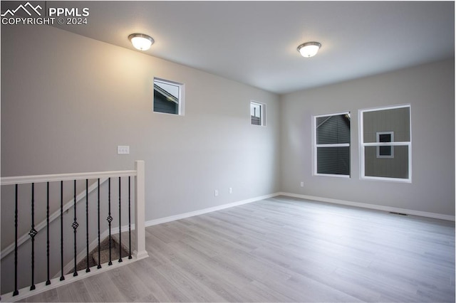 unfurnished room with light hardwood / wood-style flooring