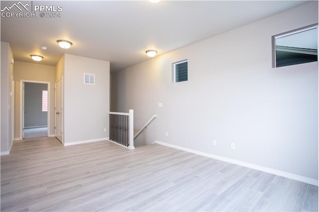 spare room featuring light hardwood / wood-style flooring