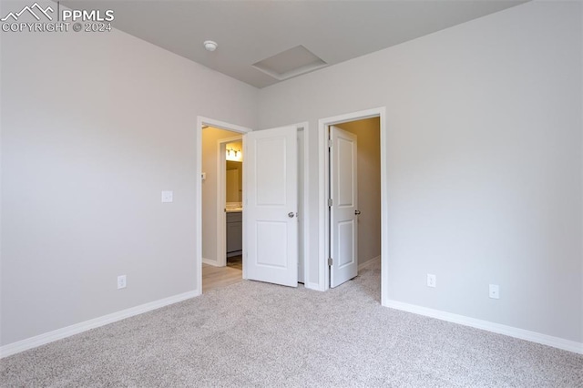 unfurnished bedroom with light carpet