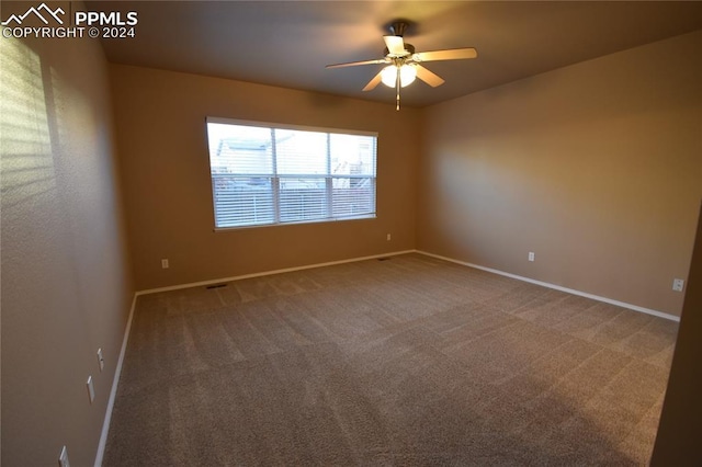 carpeted empty room with ceiling fan