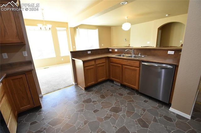 kitchen featuring dishwasher, sink, dark colored carpet, a chandelier, and pendant lighting