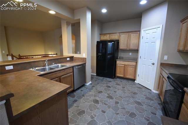 kitchen with black appliances and sink