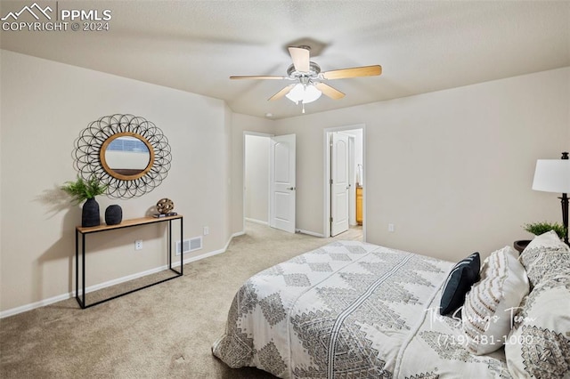 bedroom with light carpet and ceiling fan