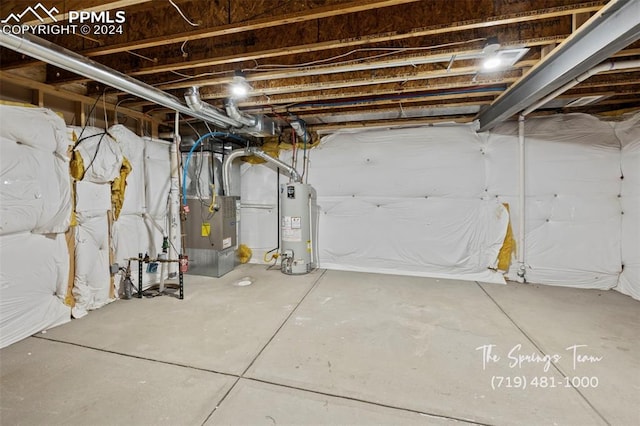 basement featuring gas water heater and heating unit