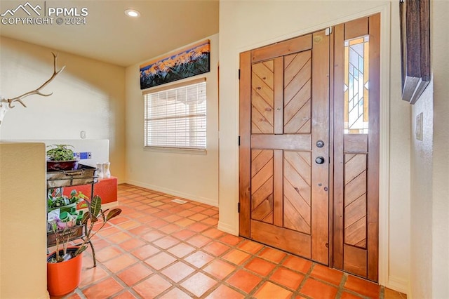 entrance foyer featuring light tile patterned flooring