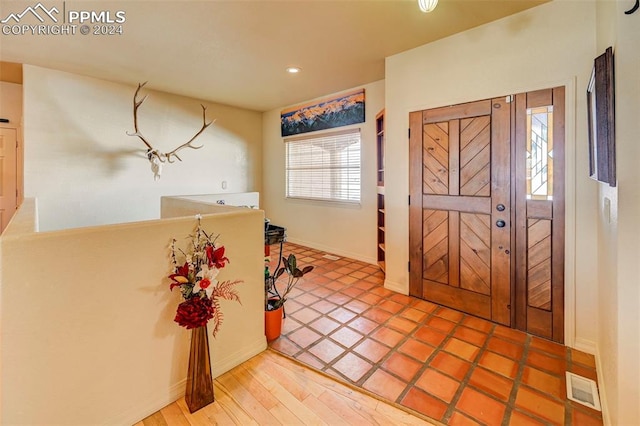 foyer with hardwood / wood-style flooring