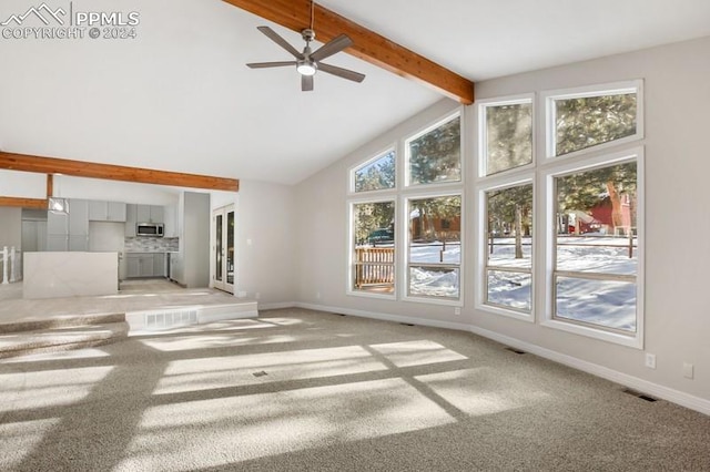 unfurnished living room with beam ceiling, light carpet, high vaulted ceiling, and ceiling fan