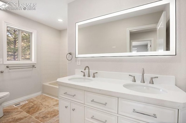 full bathroom with vanity, shower / bathtub combination, and toilet