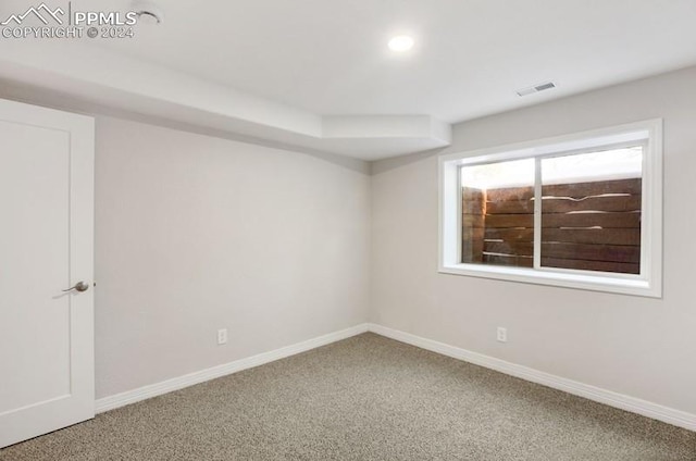 empty room featuring carpet flooring