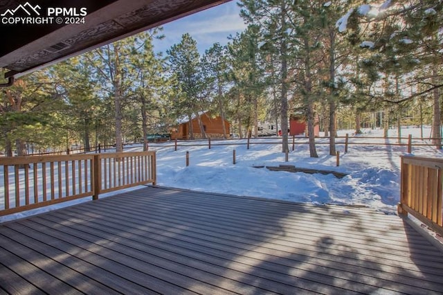 view of snow covered deck