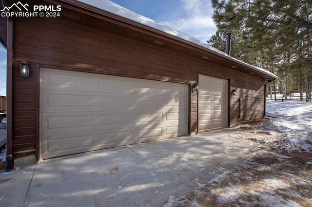 view of snow covered garage