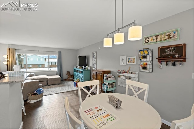 dining room with dark hardwood / wood-style floors