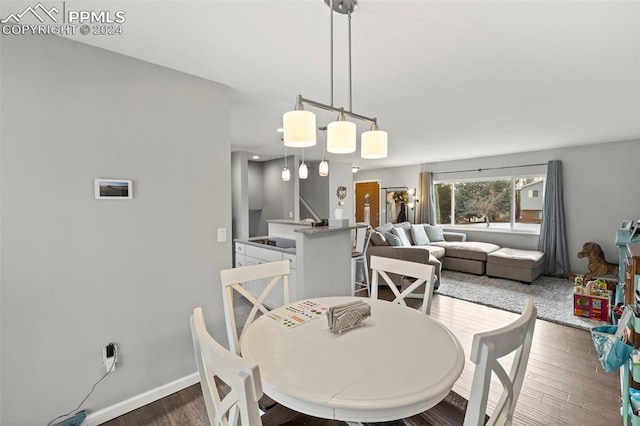 dining space featuring dark hardwood / wood-style flooring