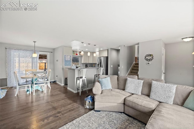 living room featuring dark hardwood / wood-style floors