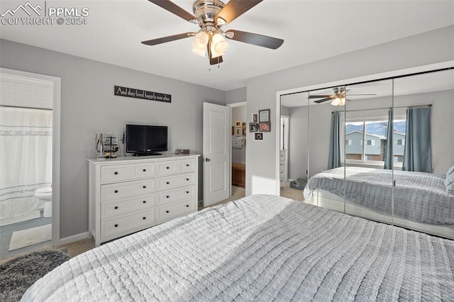 bedroom featuring ensuite bath, a closet, and ceiling fan