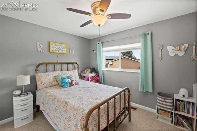 carpeted bedroom with ceiling fan