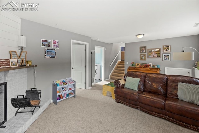 carpeted living room with washer / clothes dryer