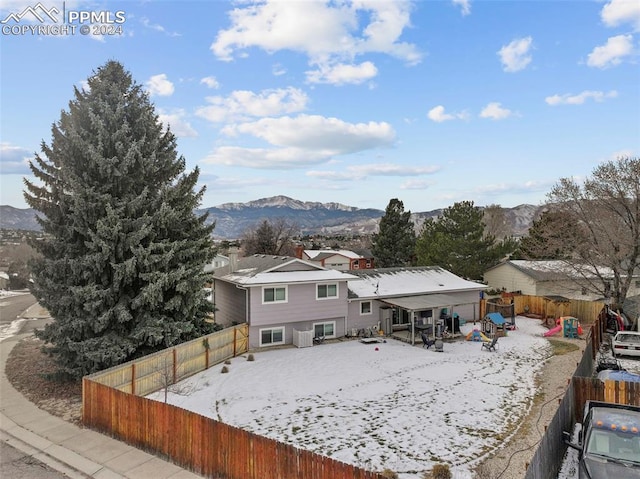 rear view of house with a mountain view