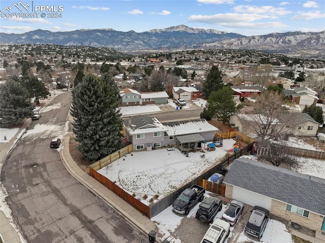 birds eye view of property with a mountain view