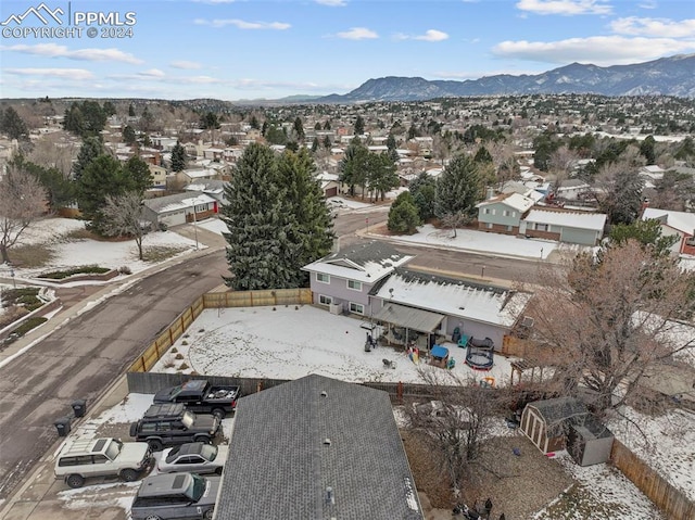 birds eye view of property featuring a mountain view