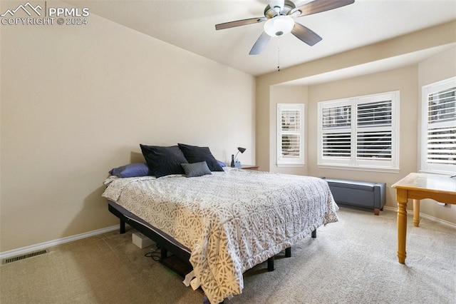 carpeted bedroom featuring ceiling fan