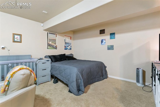 bedroom with light carpet