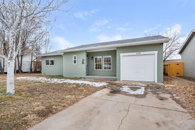 single story home featuring a garage