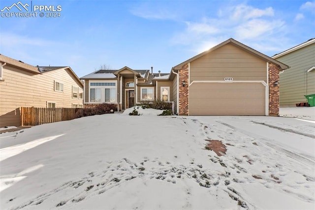 single story home with a garage