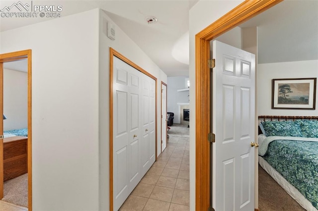 hall with light tile patterned floors